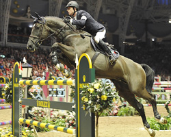 Ben Maher (Großbritannien) gewann mit Tripple X das Weltcupspringen von London. Foto: Kit Houghton